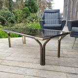 Vintage golden 70s coffee table and space age smoked glass