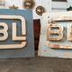 Old metal factory sign