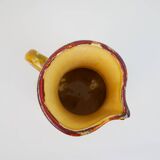 Beautiful ceramic pitcher in fire colors