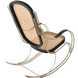 Modernist rocking chair in gilded brass and cane.
