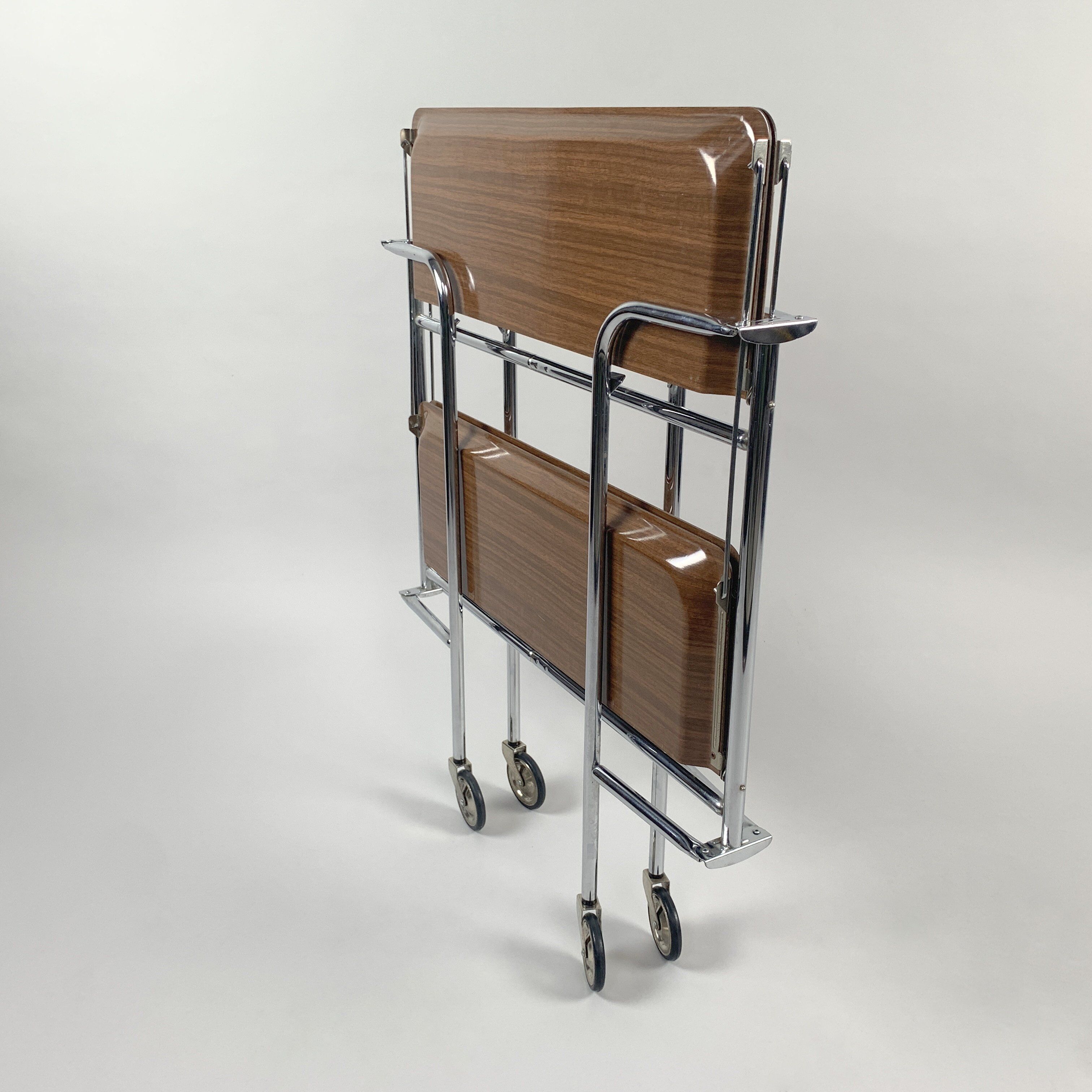 Chrome and laminated wood folding serving trolley, 1950