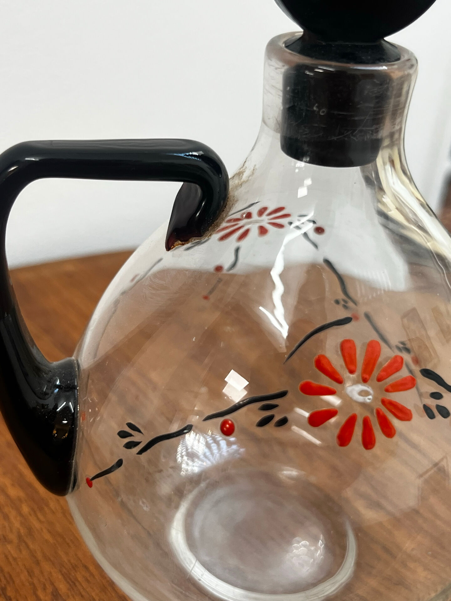 Enamelled glass carafe 1920