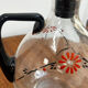 Enamelled glass carafe 1920