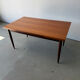 Rectangular extendable dining table with Scandinavian design in teak.