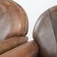 Set of 2 vintage sheepskin armchairs with a characterful appearance