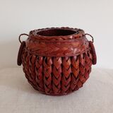 Japanese vase made of woven bamboo. Ikebana.