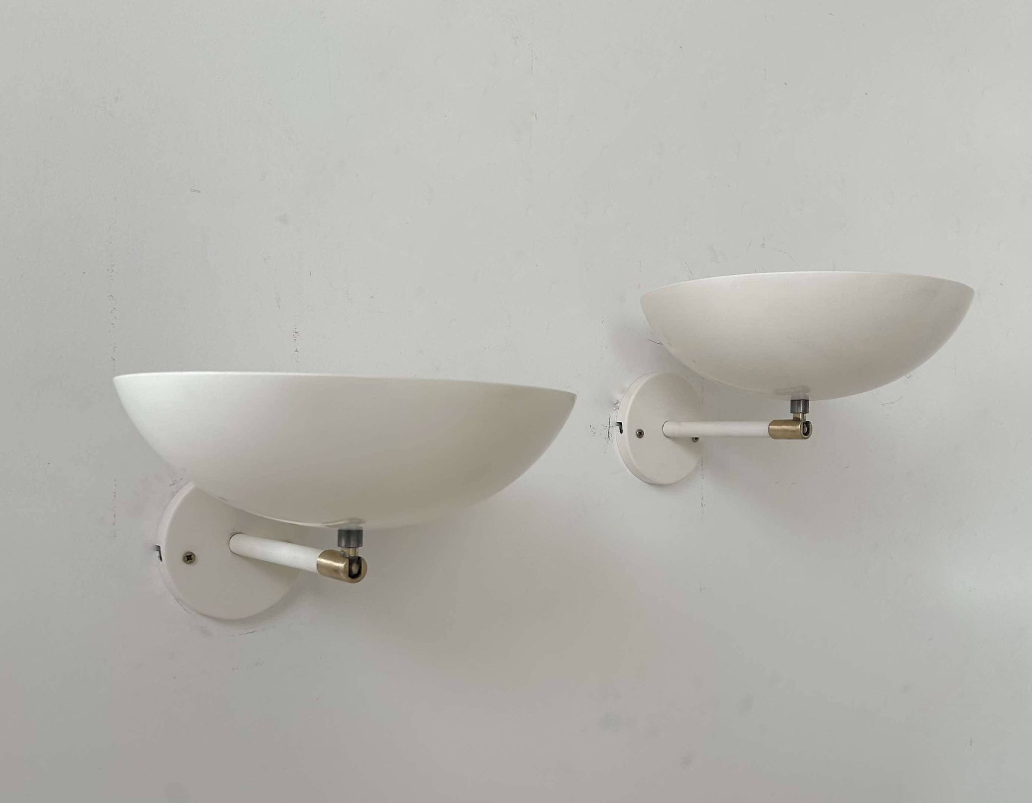 Pair of vintage adjustable wall lights, brass and white metal, France 1970