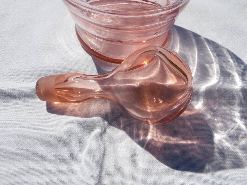 Pink transparent glass carafe with bubble cap