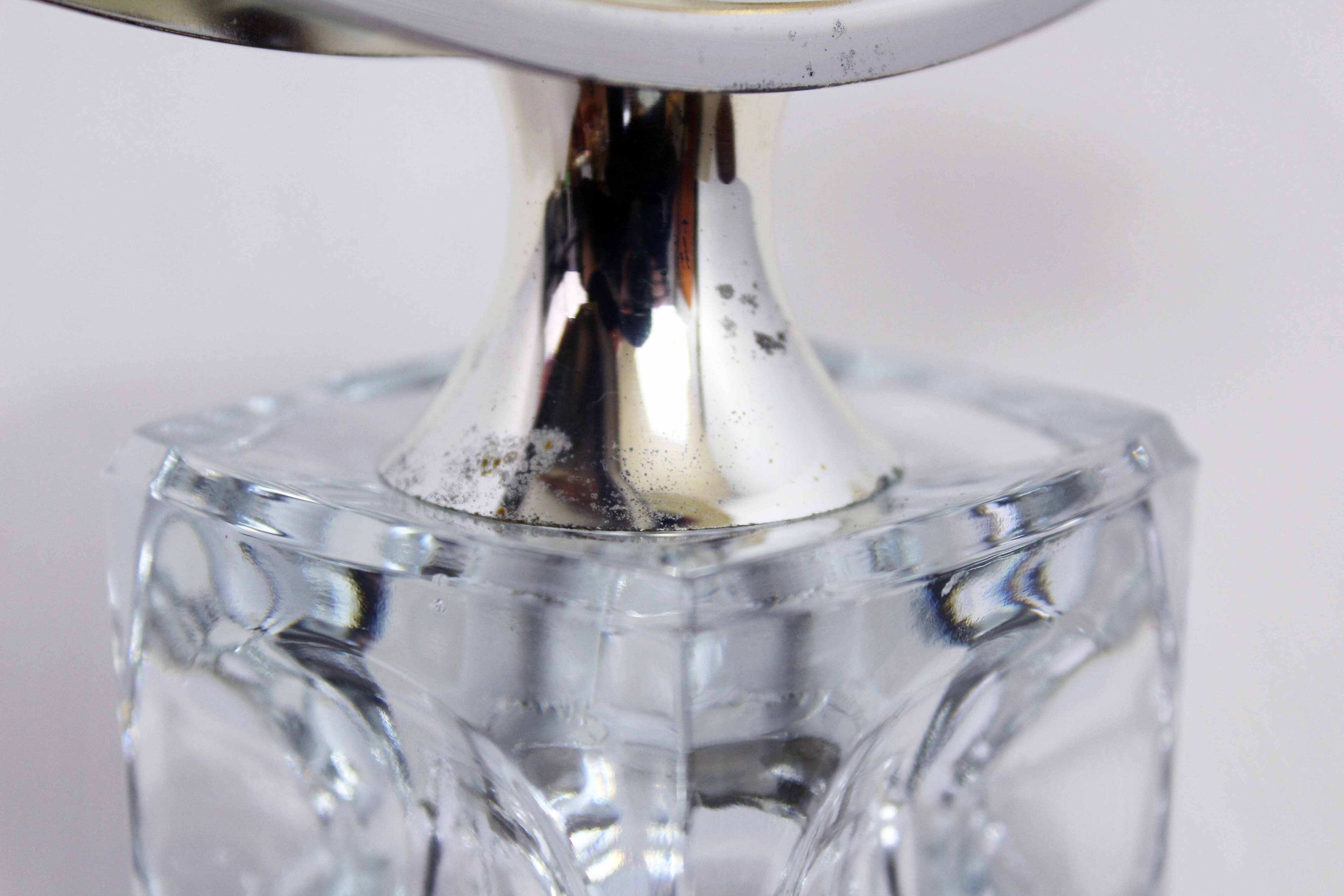 Glass and silver-plated metal candle holder