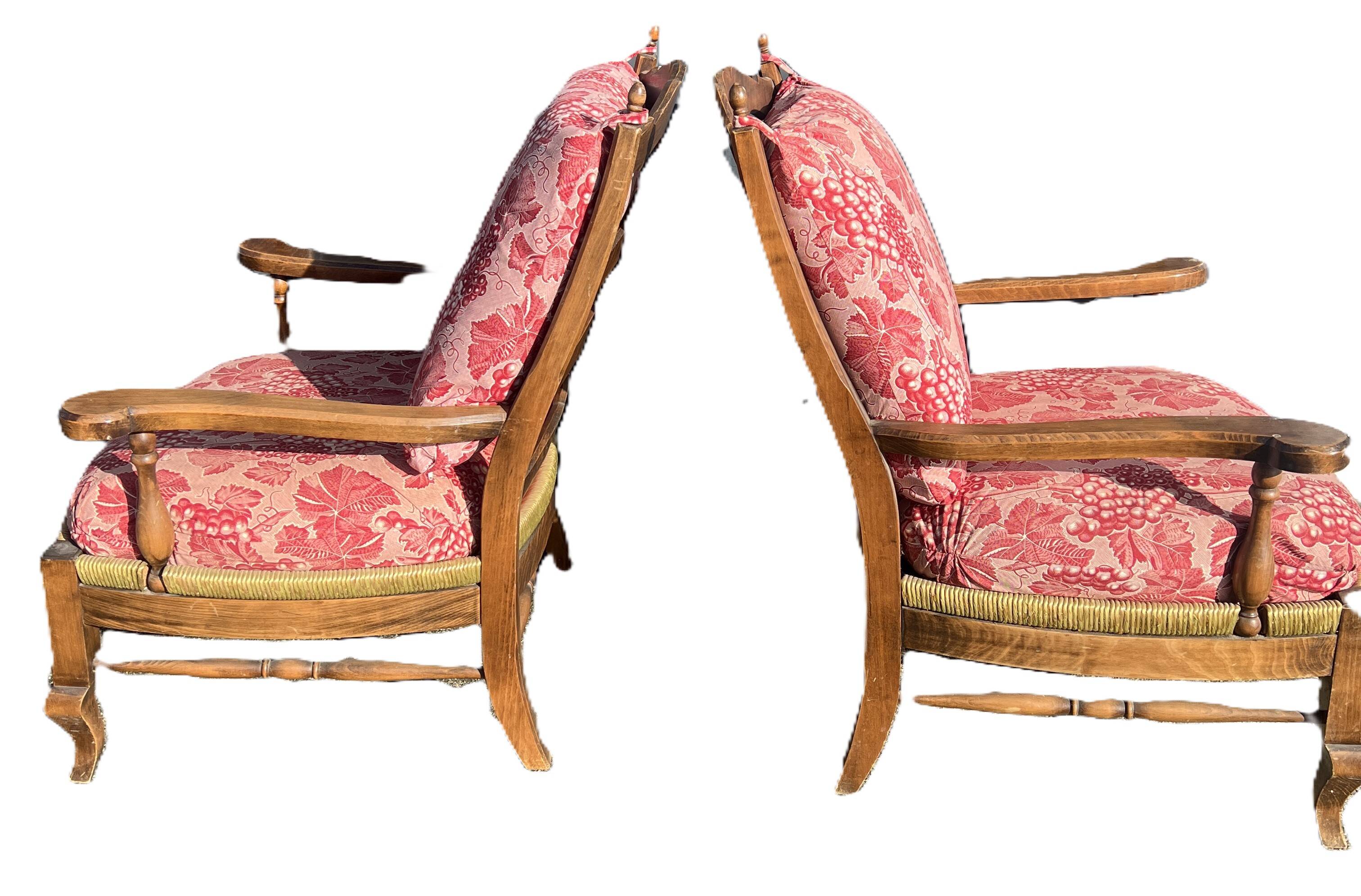 pair of rustic wood and fabric armchairs