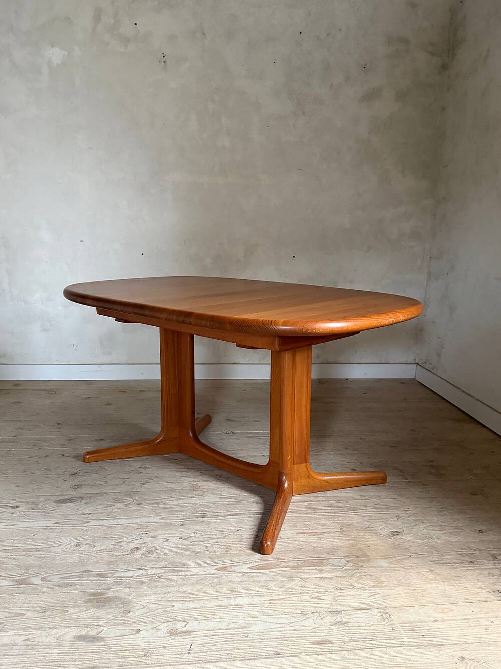 Vintage oval teak Scandinavian table with a central star base from Glostrup.
