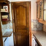 Interior door in carved and framed solid wood
