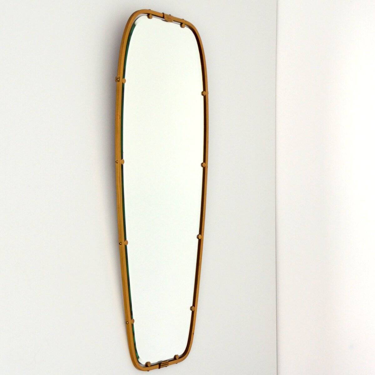 Superb free-form mirror in solid brass from the 50s/60s vintage.
