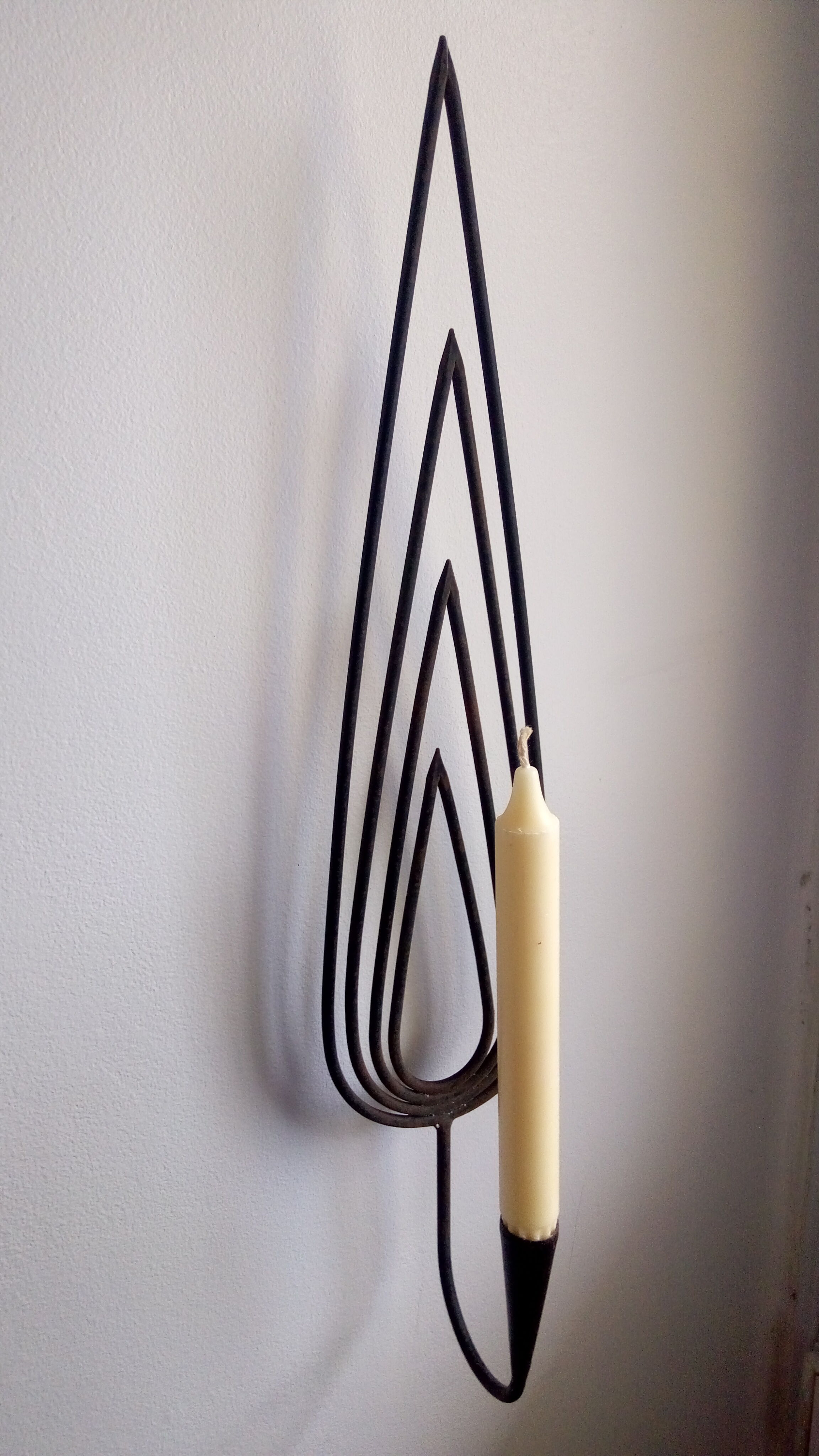 Wrought iron candlestick applied