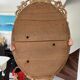 Miroir ovale biseaute  en bois et stuc