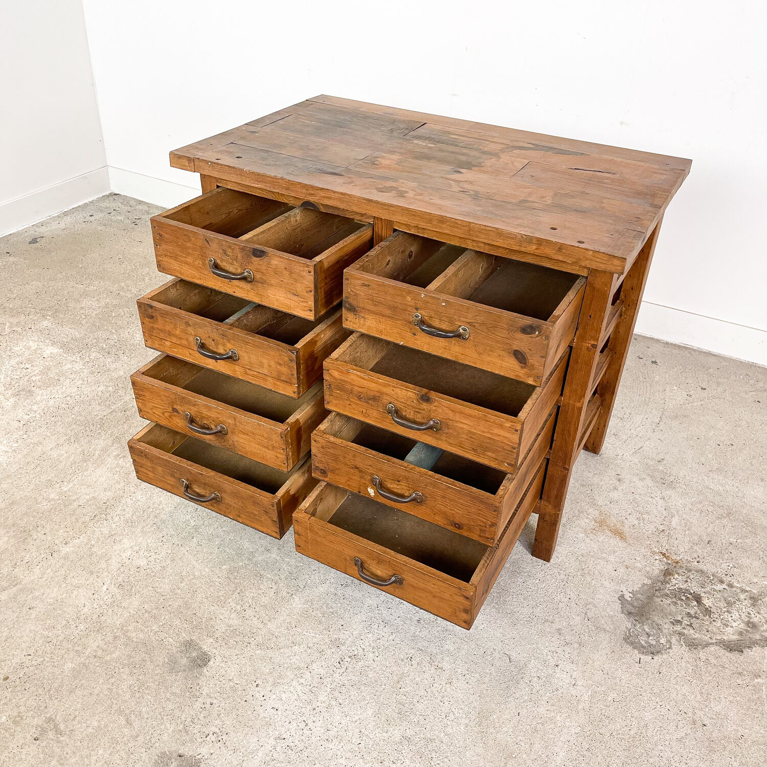 Vintage industrial wooden workbench with drawers