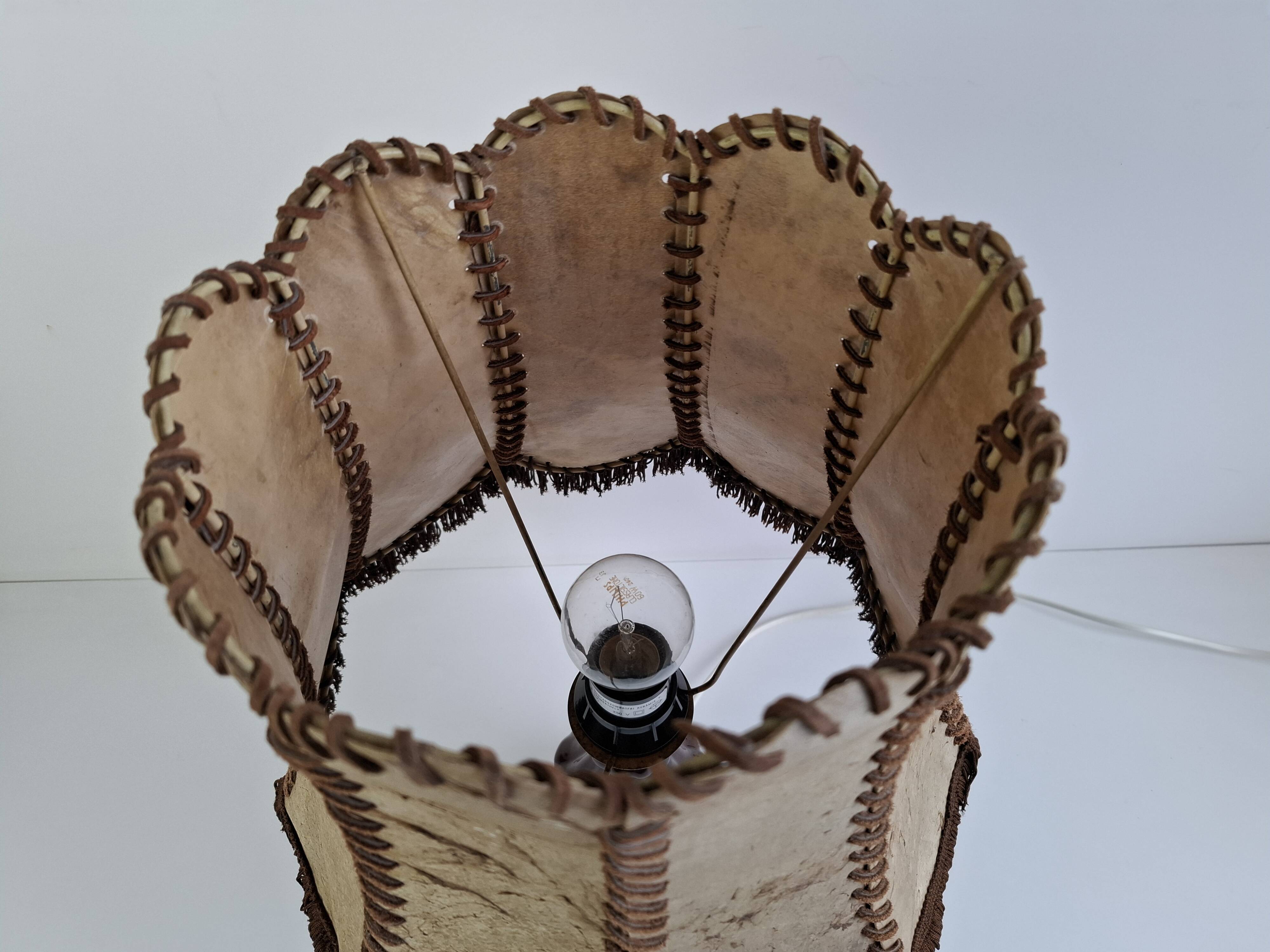 Vintage ceramic table lamp with hand-stitched leather shade, 1980s.