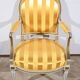 Pair of Cabriolet Armchairs, in rechampi wood, Louis XVI style – Late 19th century