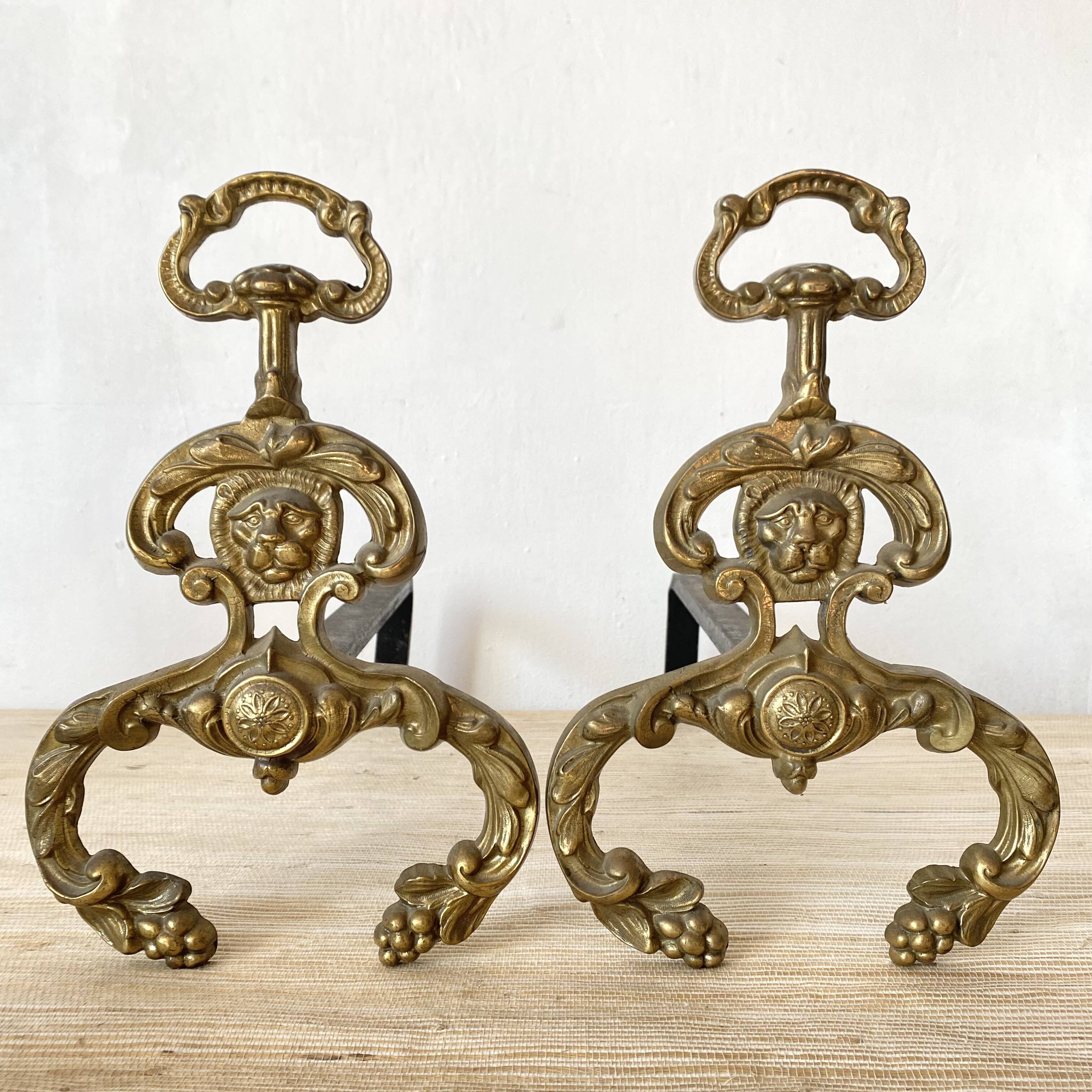 Pair of brass andirons, lion head