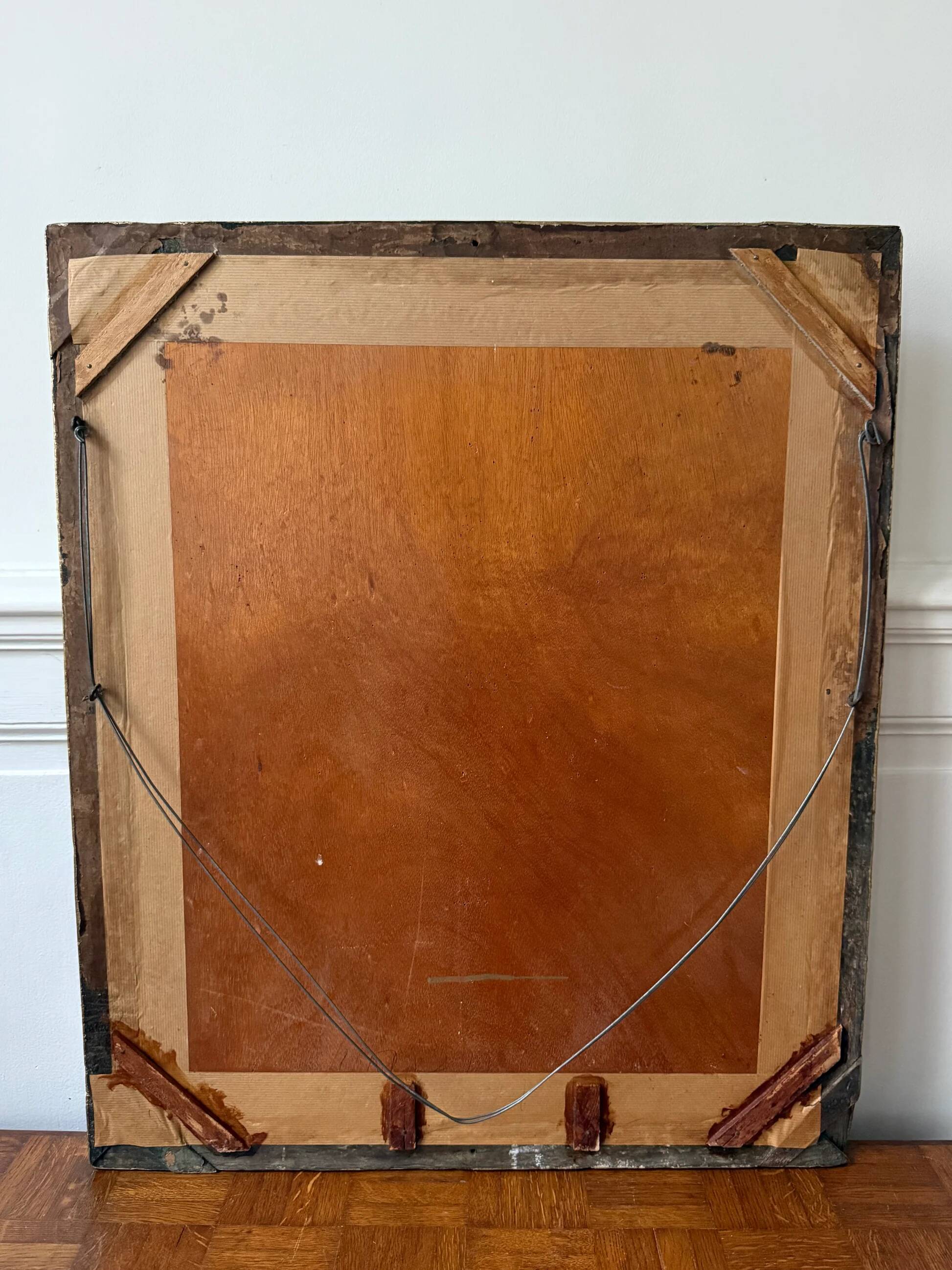 Bevelled mirror in carved gilded wood