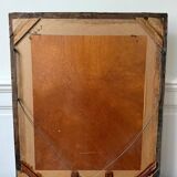 Bevelled mirror in carved gilded wood