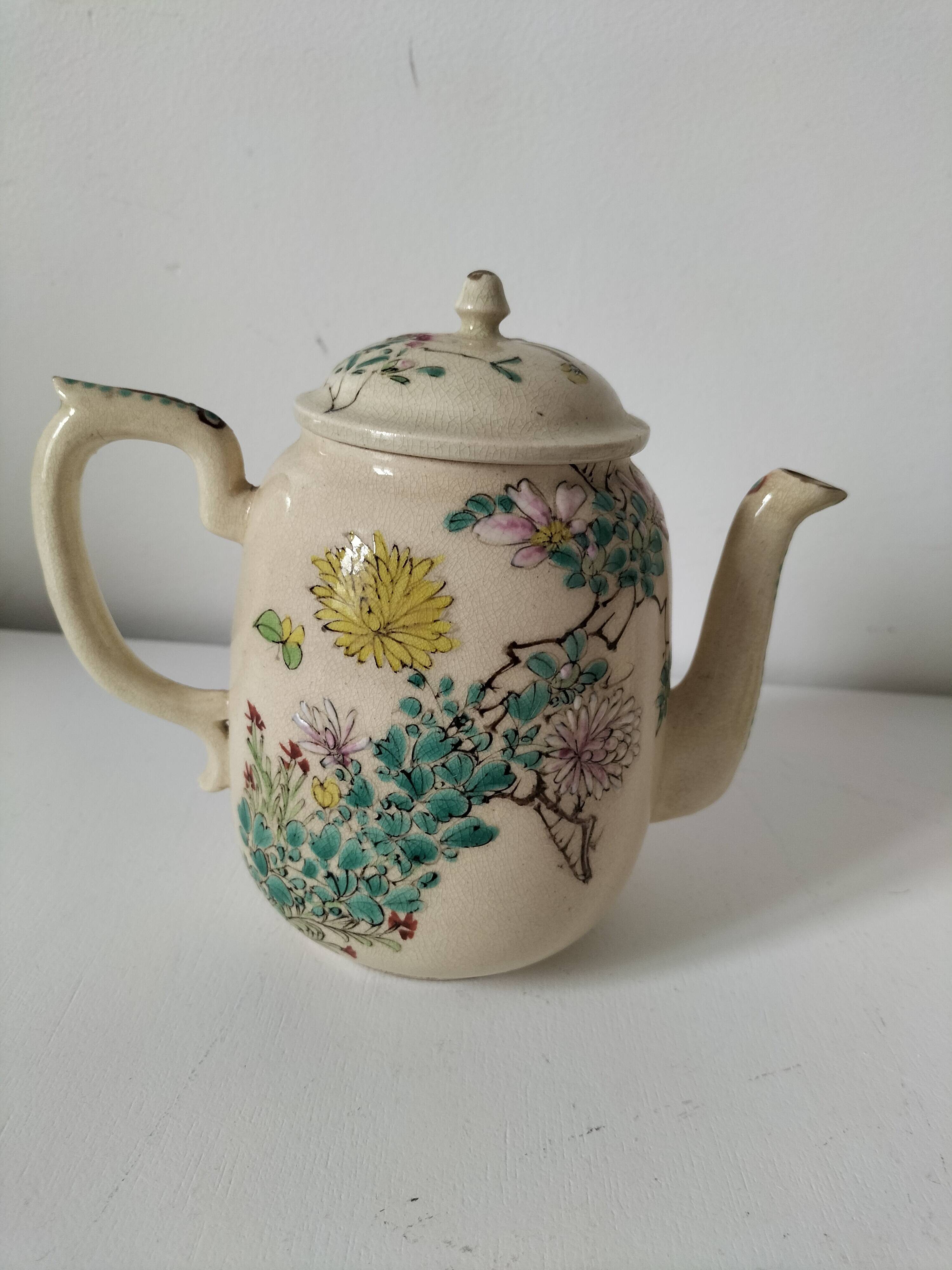 Japanese-style tea set in cracked earthenware with chrysanthemum flowers