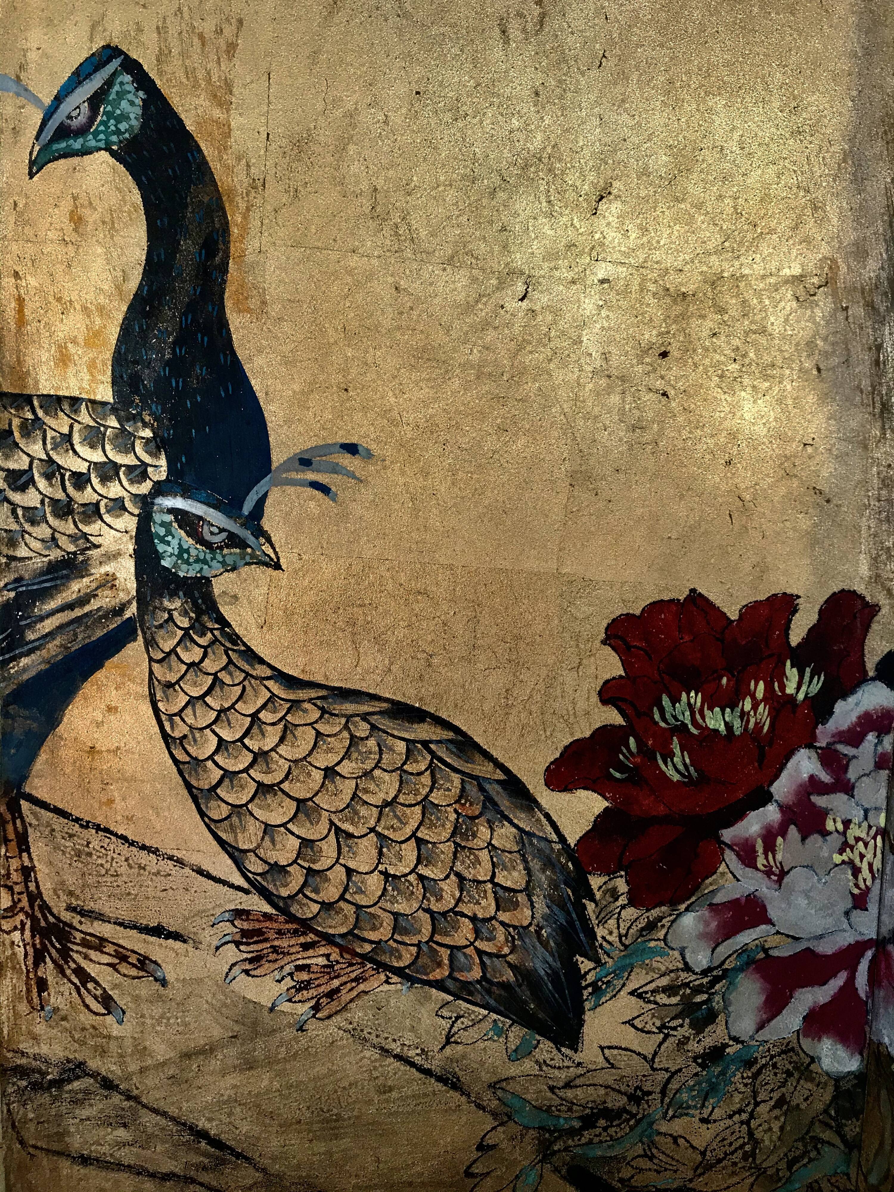 Ancient Chinese screen decorated with peacocks and flowers on gold leaf