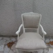 Louis XV style armchair, delicately patinated in a soft beige hue.