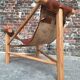 Vintage tripod armchair, designer seating furniture