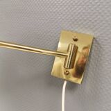 Danish Brass wall lamp with a ‘swivel’ effect.