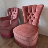 A pair of small tub chairs.