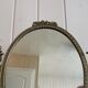 Oval mirror on psyche stand