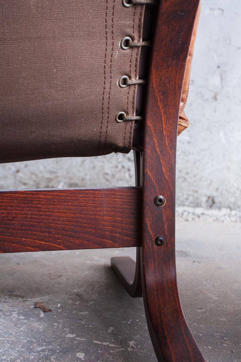 Siesta armchair by Ingmar Relling with ottoman — bentwood dark brown frame, cognac leather