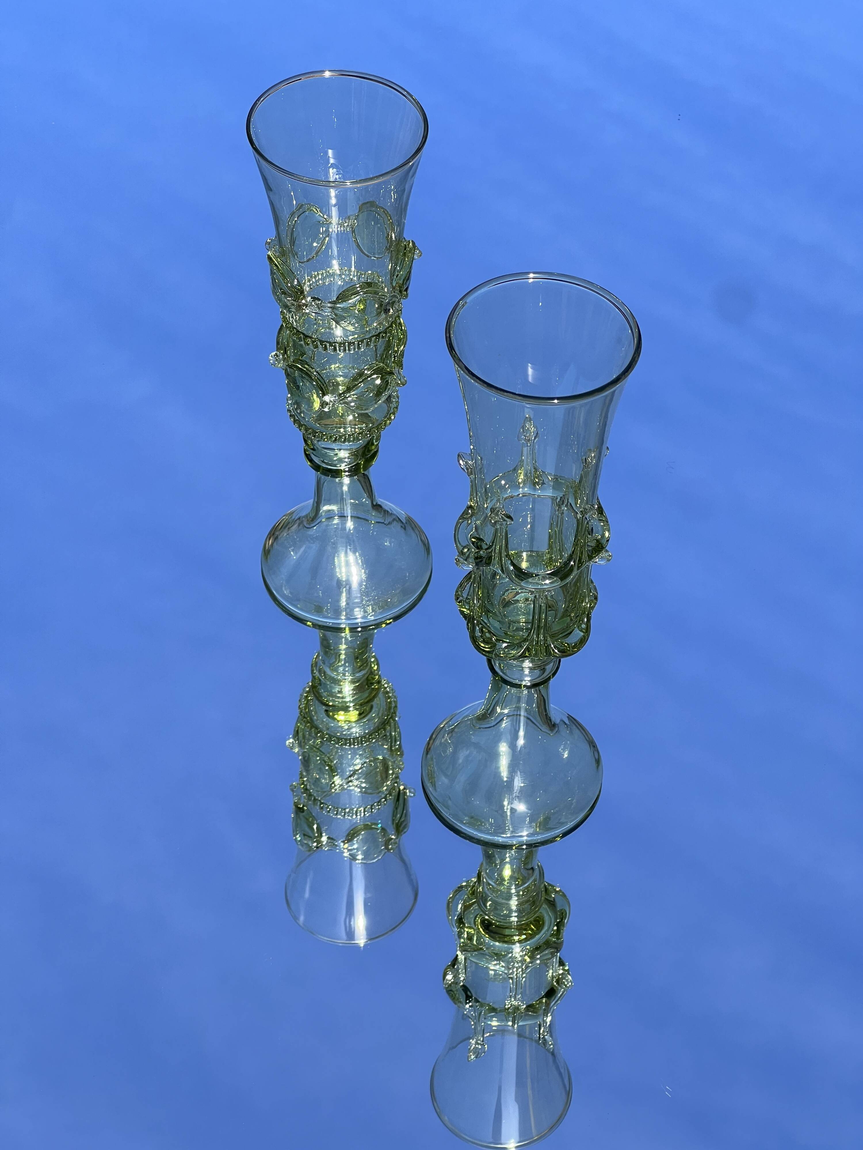 pair of green glass champagne flutes - points