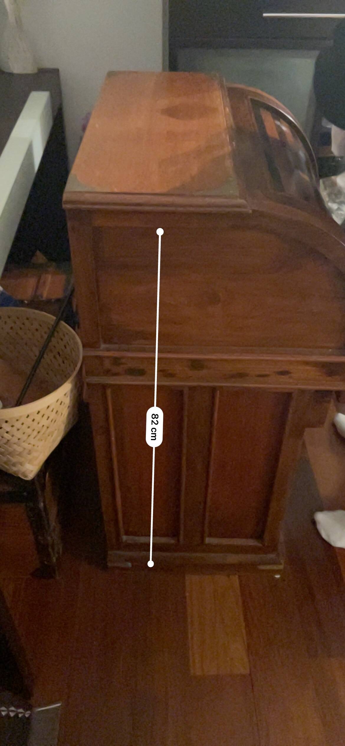 Antique solid wood secretary with a drop-down cylinder compartment.