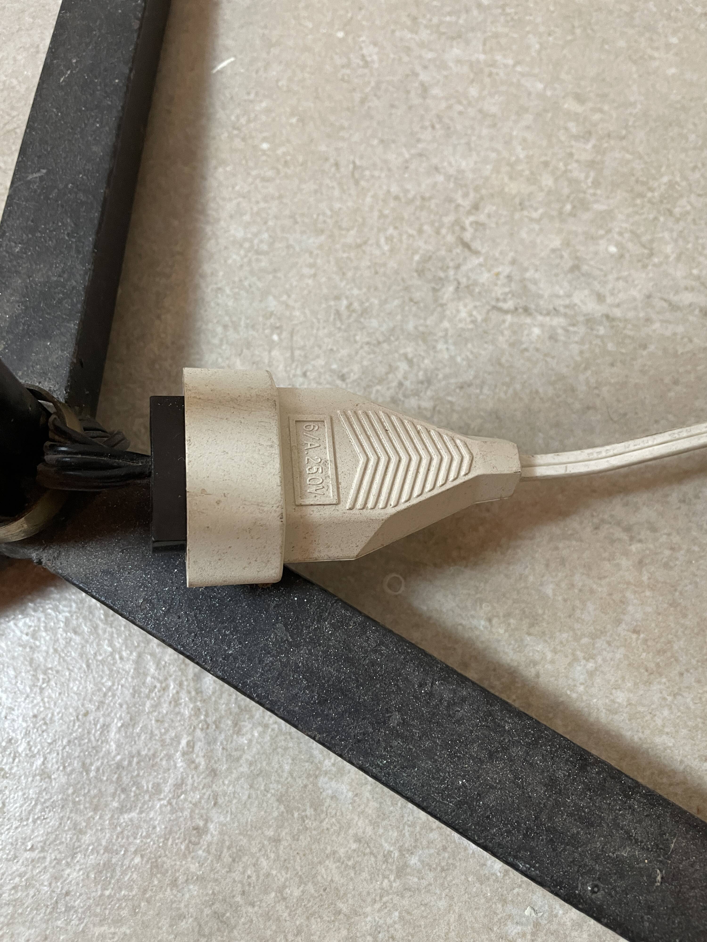 Wrought iron tripod lamp