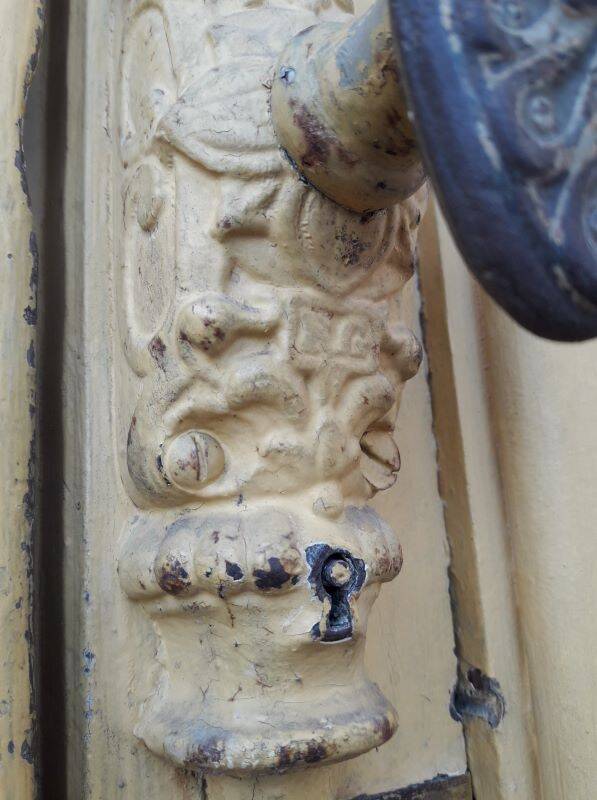19th century double arched entrance door in oak with grilles and old glass
