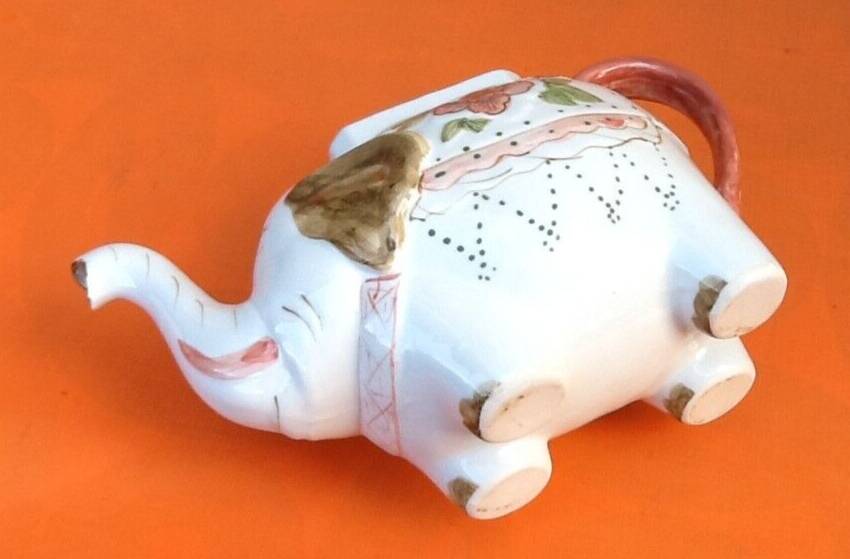 White porcelain teapot decorated with peonies elephant shape