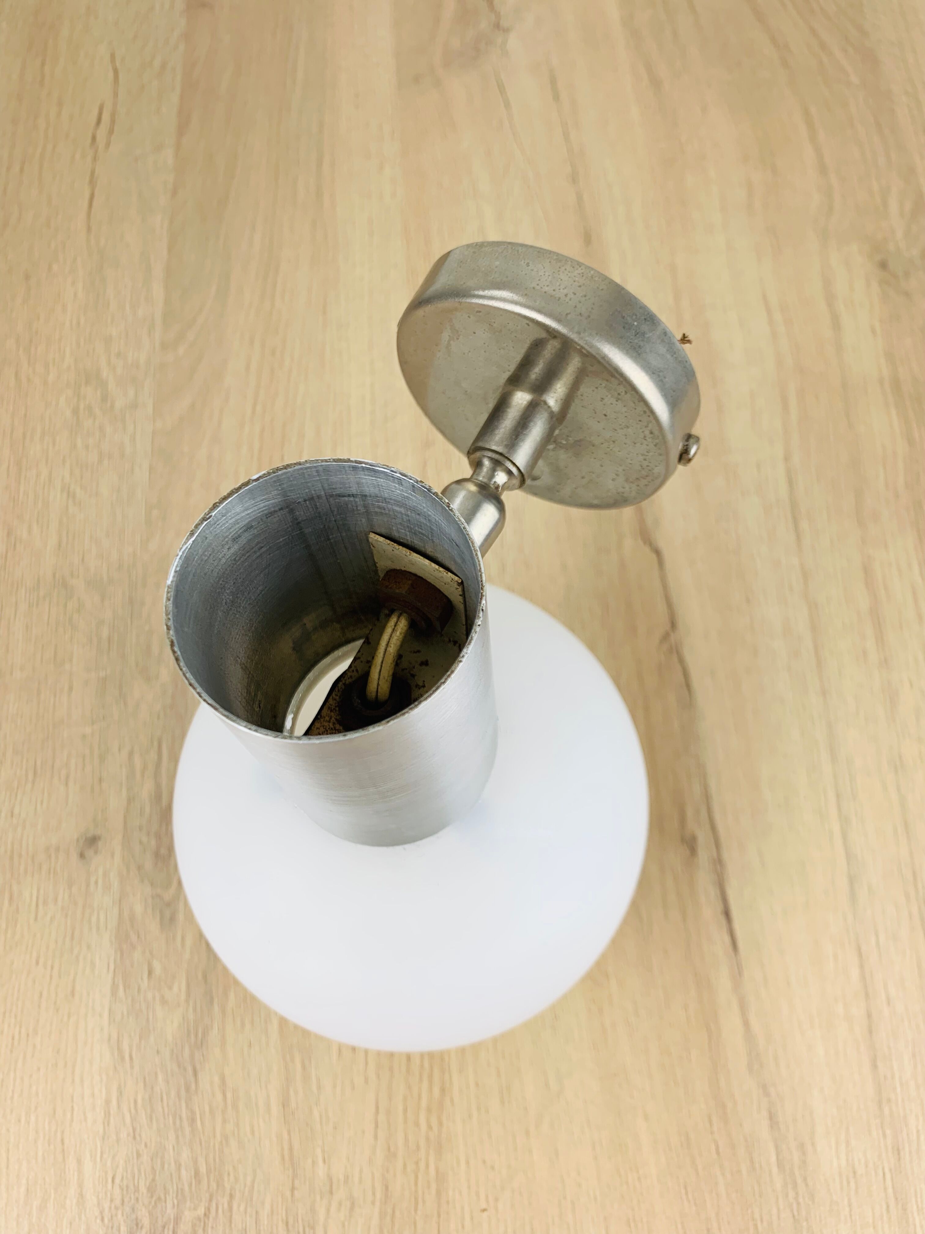 Space age opaline globe wall light, adjustable, and brushed metal, 1960s.
