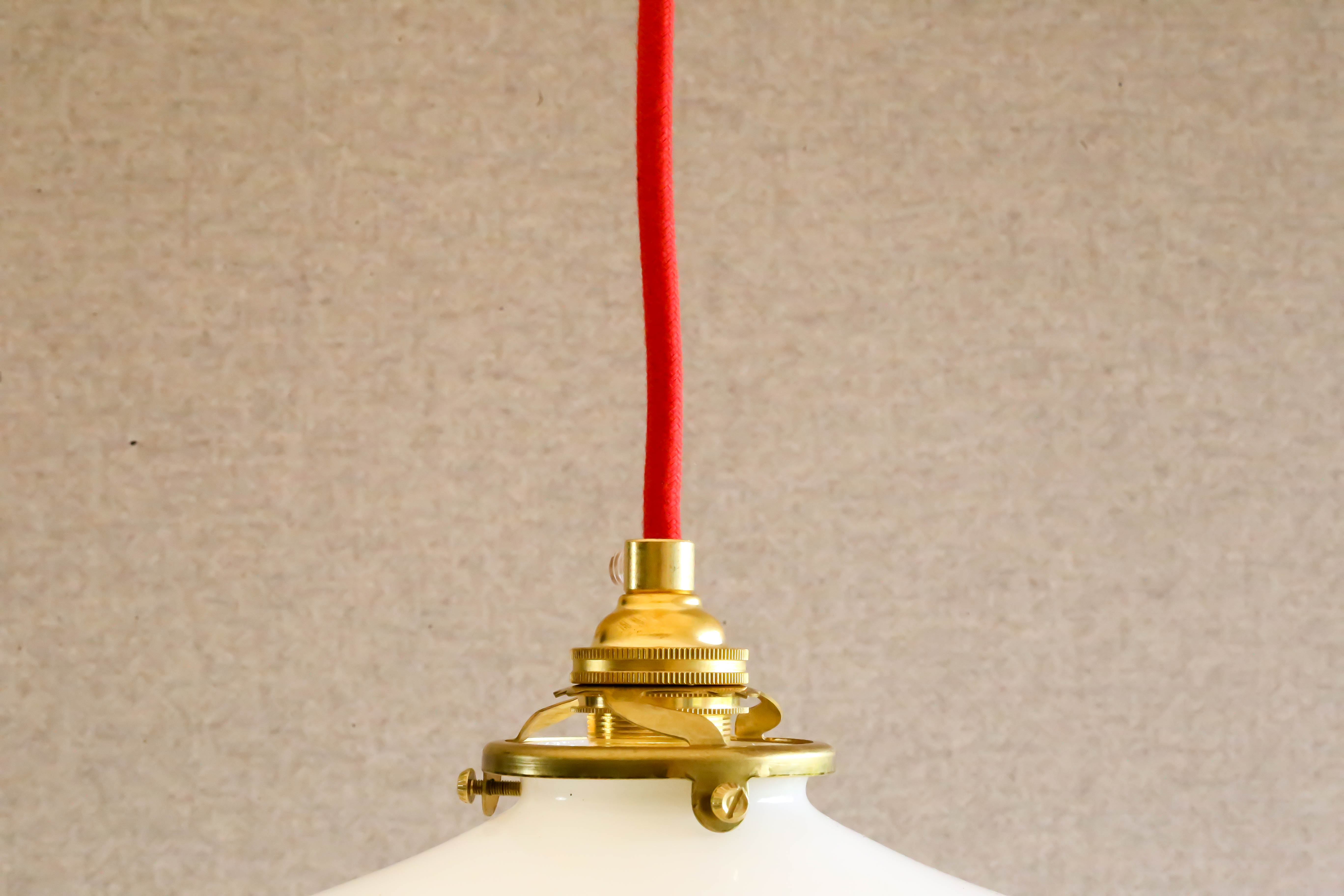 Toothed white opaline pendant lamp with new brass cable and socket