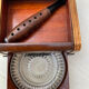 Art Deco wooden and brass cigarette box with curtain + glass ashtray