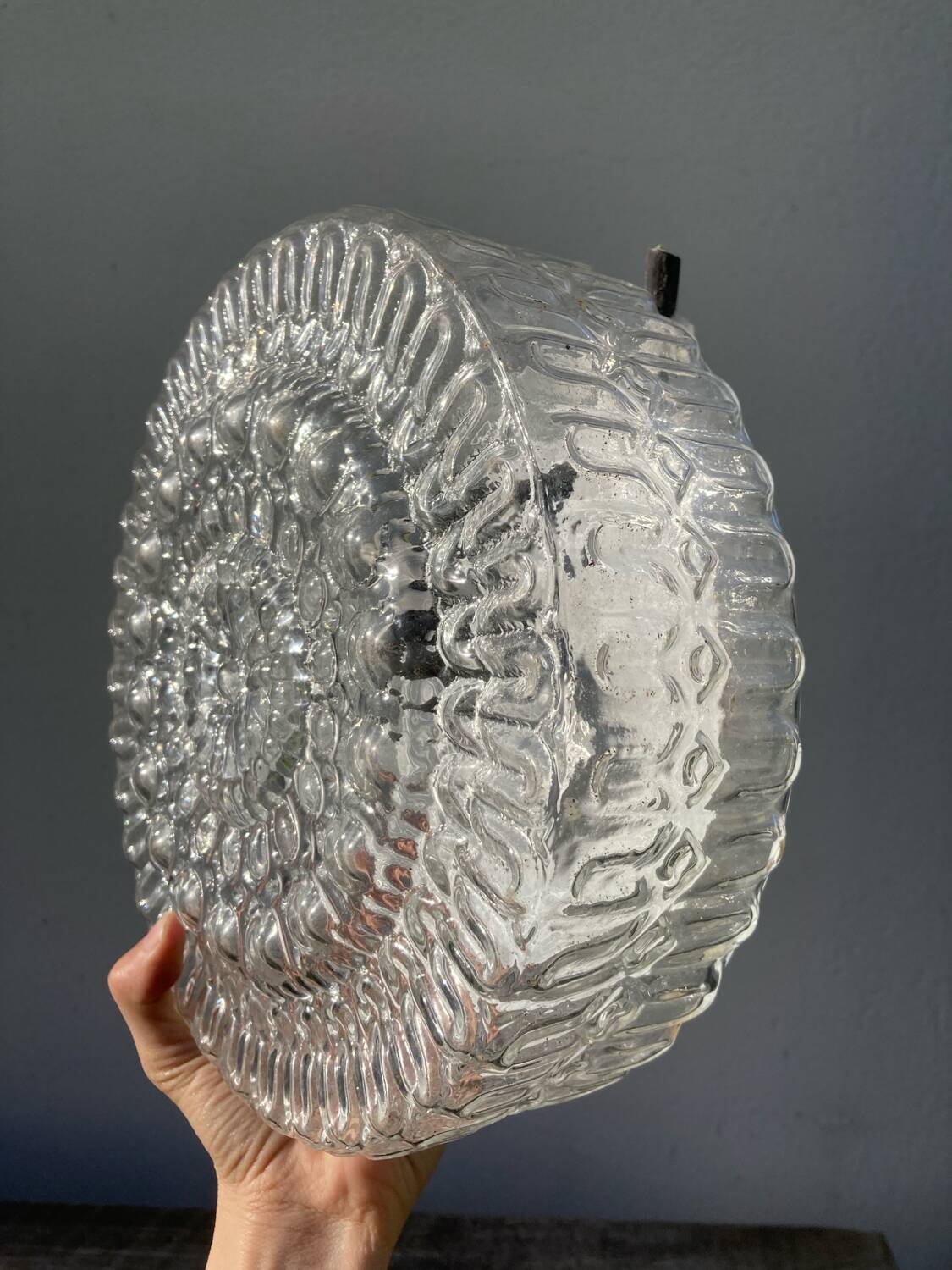 Pair of transparent round glass wall lights
