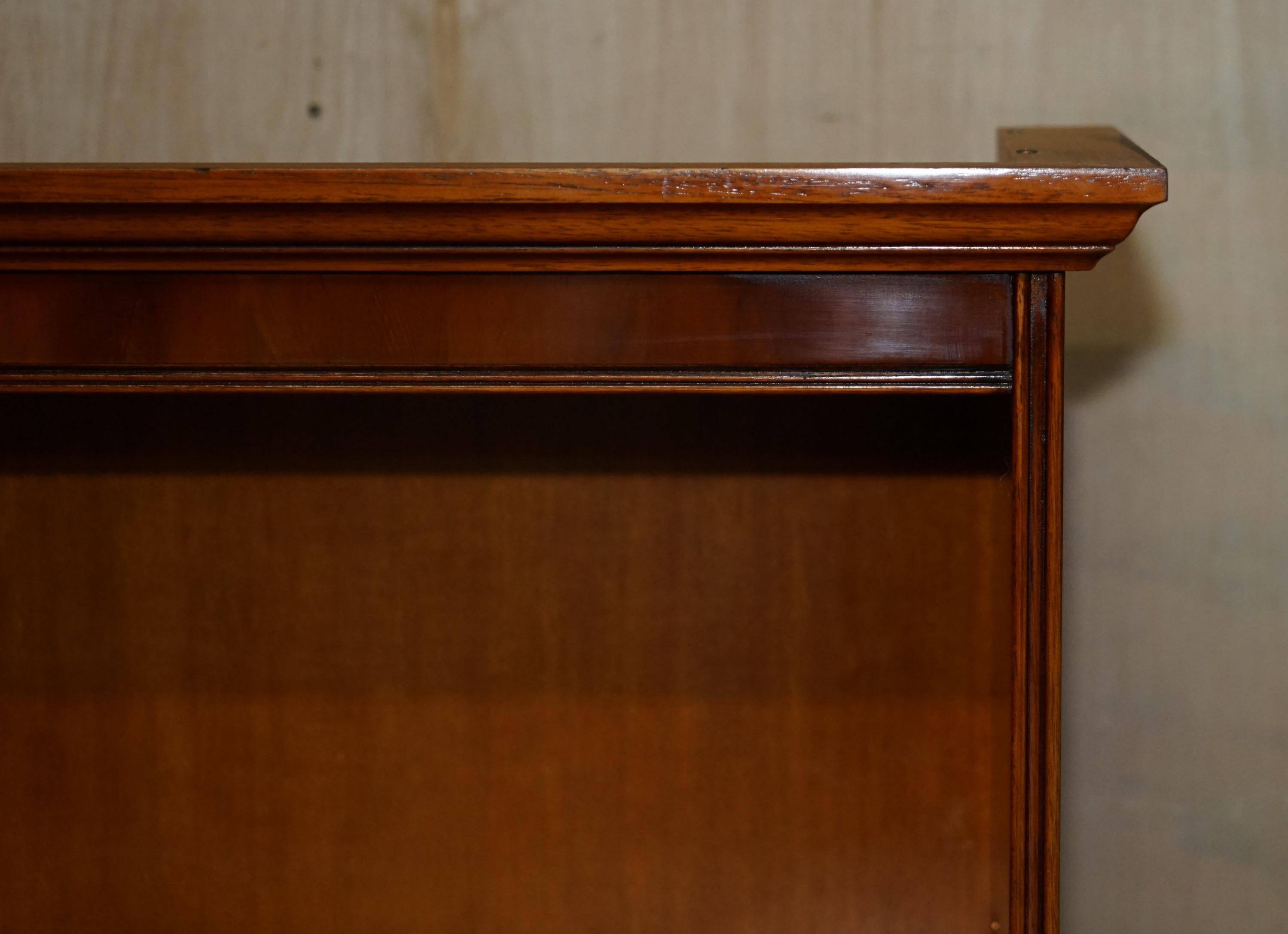 Open library Bradley Furniture made of yew wood with a cupboard base.