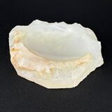 Empty pocket bowl made of translucent natural stone.