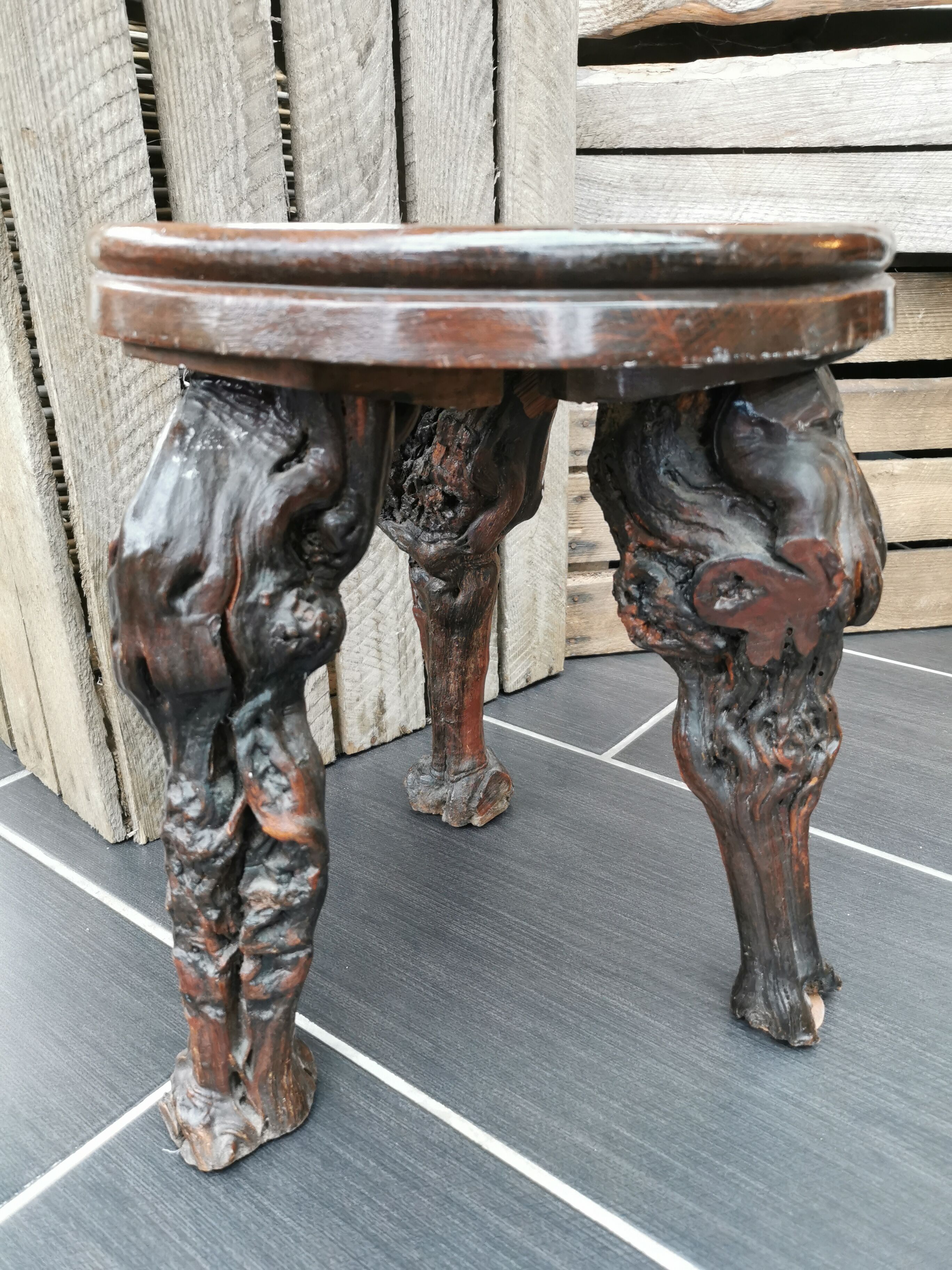 Artisan tripod stool in vines