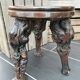 Artisan tripod stool in vines