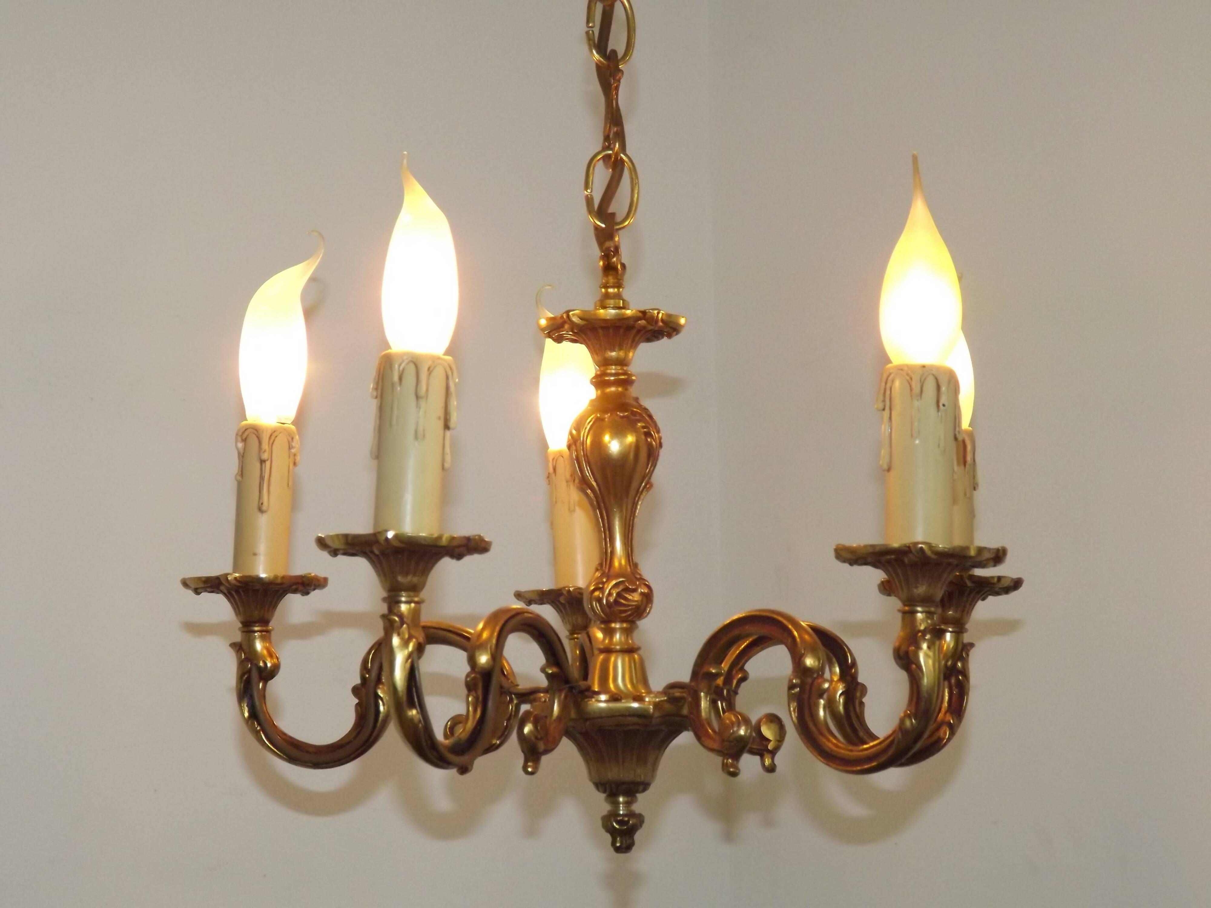Vintage French traditional style bronze chandelier with 5 lights featuring acanthus leaf details.