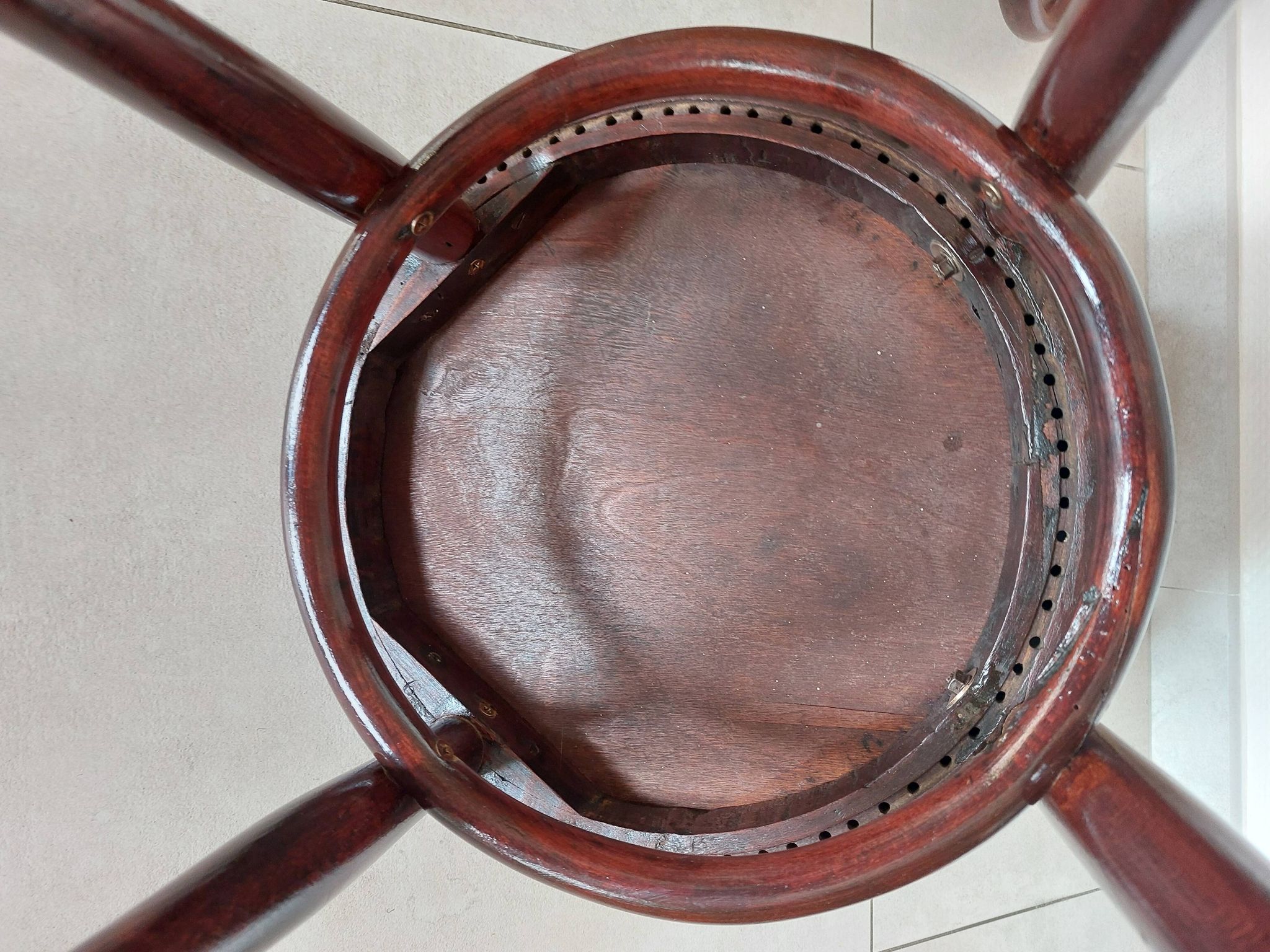 pair of round bistro chairs with a pattern on the seat, vintage