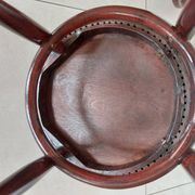 pair of round bistro chairs with a pattern on the seat, vintage