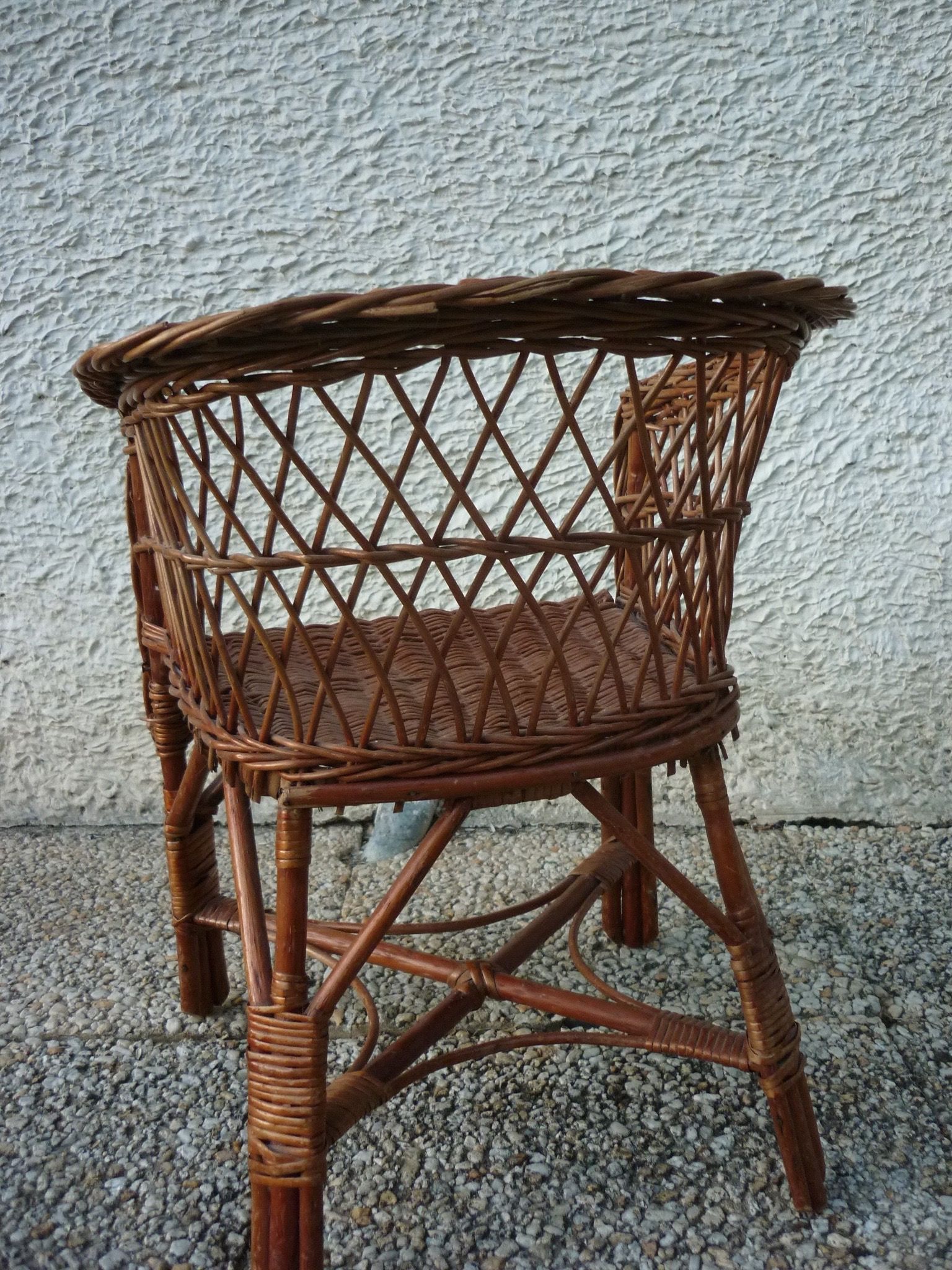 Children's basket chair in vintage braided wicker
